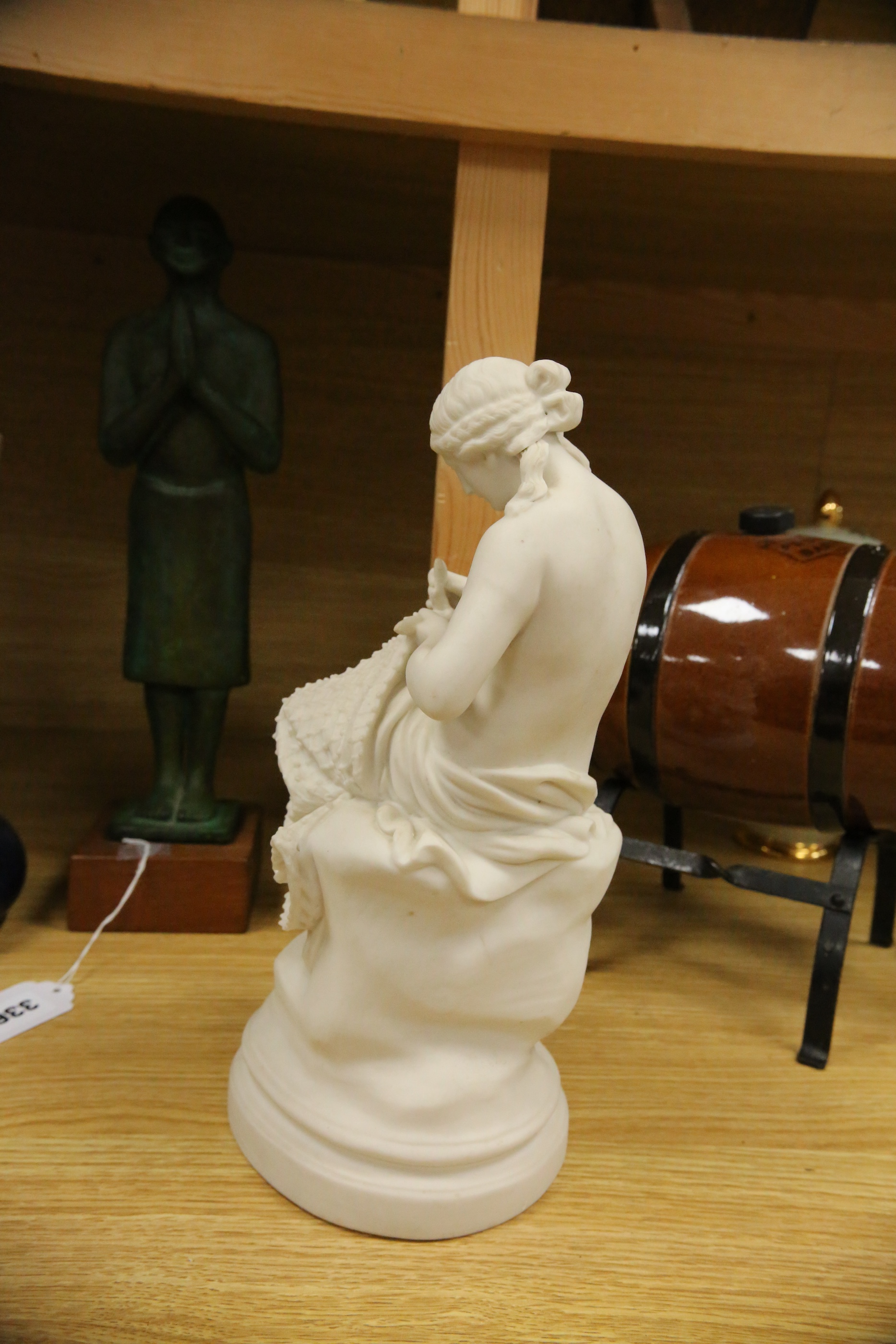 A Parian porcelain figure of a girl mending a fishing net, a Carltonware jar and cover, a “Pedestrian Barrelette” on stand and thirteen various Art Nouveau metal trays, dishes and candlestick including WMF etc, largest t